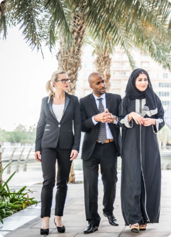 UAE residents on a palm-lined promenade